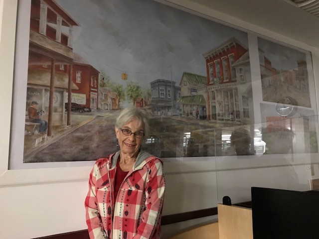 Mary Jane Bugh with art installed at Thornville Branch